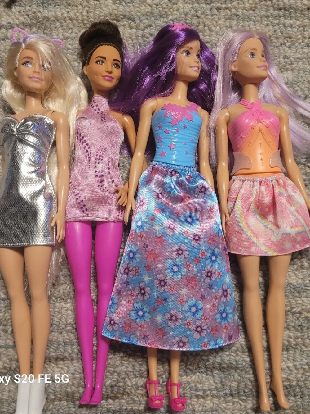 Four Barbie Dolls